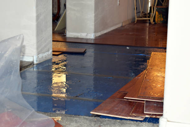 Professional Flood Damage Restoration technician working in Lawrence, NY